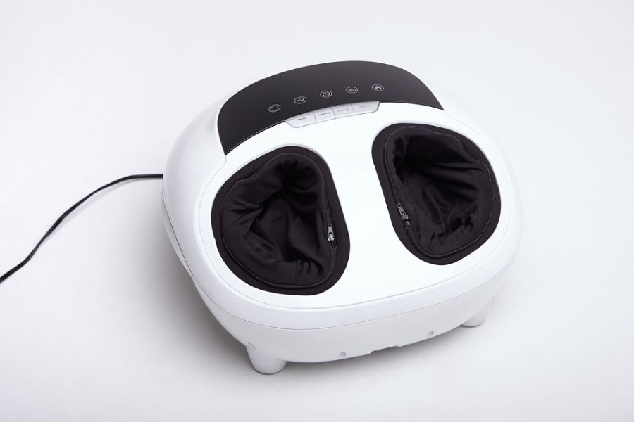 white foot and calf massager on the floor white foot and calf massager on the floor